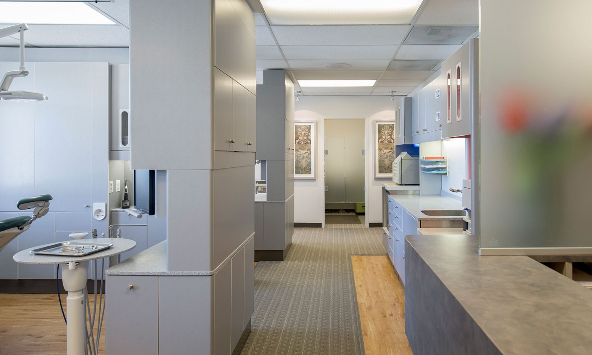 Main Hallway at Dental Office Shows Three Exam Rooms and a Sterilization Area